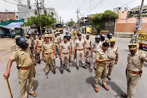 Security personnel conduct a flag march, a day after clashes during protest against now-suspended BJP leaders remark on Prophet Muhammad, in Prayagraj. (Photo | PTI)
