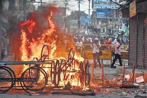 Carts set on fire during a protest march in Ranchi on Friday | PTI