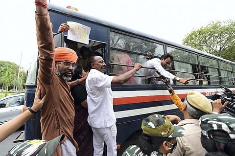 Congress activists being detained during a protest against summoning of the party's president Sonia Gandhi and party leader Rahul Gandhi in the National Herald case. (Photo | PTI)