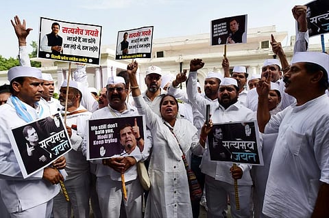 Congress activists being detained during a protest against summoning of party leader Rahul Gandhi in the National Herald case, in New Delhi. (Photo | PTI)
