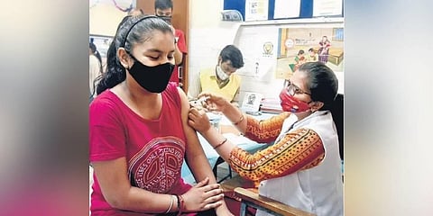 A health worker administers a dose of Covid-19 vaccine at Darya Ganj (Photo | Express)