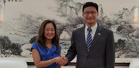 Chinese Ambassador to Sri Lanka Qi Zhenhong met his US counterpart Julie Chung. (Photo | Twitter)