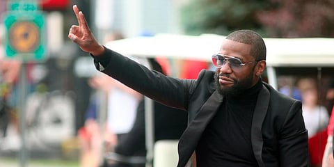 International Boxing Hall of Fame class of 2021 inductee Floyd Mayweather acknowledges paradegoers during the annual Parade of Champions on Sunday, June 12, 2022, in Canastota. (Photo | AP)