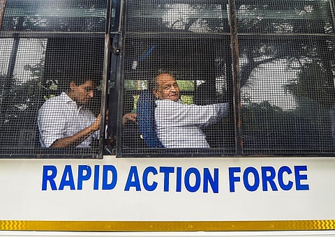 ajasthan Chief Minister Ashok Gehlot with party leader Deepender Singh Hooda sit inside RAF's vehicle during their protest march in New Delhi on Monday. (Photo | PTI)