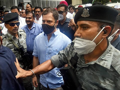 Congress leader Rahul Gandhi leaves for ED office amid protests by party workers, after being summoned for questioning in the National Herald case, in New Delhi. (Photo | PTI)