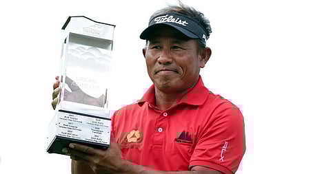 Thongchai Jaidee holds up the American Family Insurance Championship golf tournament trophy after his win at University Ridge in Madison. (Photo | AP)
