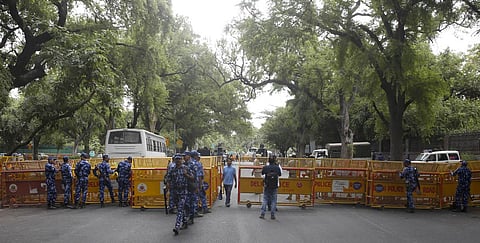 Police personnel stand guard near ED office, during summoning of Congress leader Rahul Gandhi in the National Herald case, in New Delhi. (Photo | Shekhar Yadav, EPS)