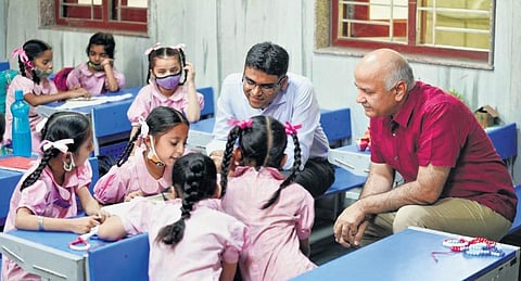 Delhi’s Deputy CM Manish Sisodia interacts with schoolchildren (Photo | Express)