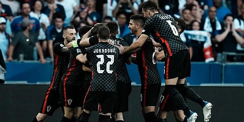 Croatia's Luka Modric celebrates with teammates after scoring his side's opening goal during the UEFA Nations League soccer match between France and Croatia at the Stade de France. (Photo | AP)