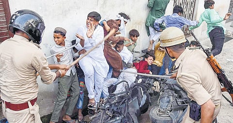 Police baton-charge protestors in Prayagraj on June 10