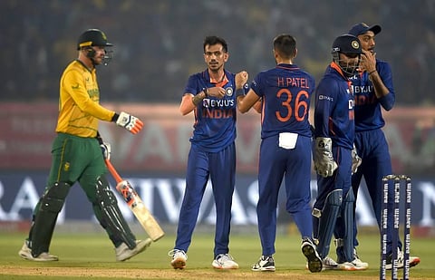 Indian bowler Yuzvendra Chahal celebrates with teammates after the wicket of South Africa's batsman Rassie van der Dussen, during the third T20 cricket match between India and SA. (Photo | PTI)