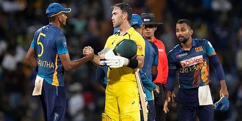 Australia batter Glenn Maxwell is congratulated by Sri Lankan team members after Australia's two wicket win over Sri Lanka in the first ODI match in Pallekele, Sri Lanka. (Photo | AP)
