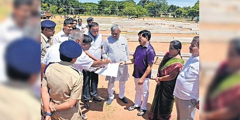 ​  Minister S T Somashekhar inspects preparations at Maharaja College Grounds in Mysuru on Tuesday ahead of PM Narendra Modi’s visit | Udayashankar S  ​