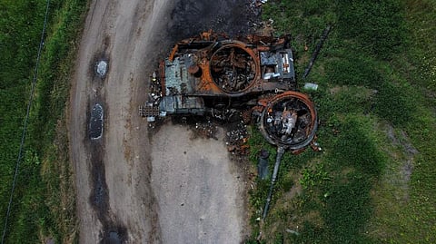 The gutted remains of a tank lie by a road in Lypivka, on the outskirts of Kyiv, Ukraine. (Photo |AP)