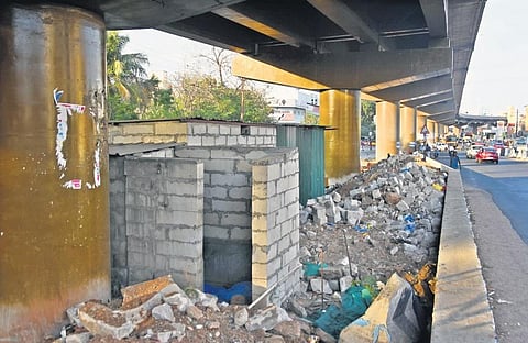 Construction debris dumped under a bridge in Medavakkam. (Photo| Ashwin Prasath, EPS)
