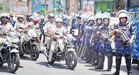 Rapid Action Force and police conduct a flag march to maintain law and order in Ranchi on Sunday. (Photo | PTI)