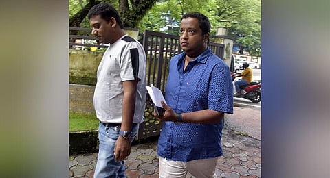 Shaj Kiran and his business partner Ibrai K appear at Police Club in Kochi as part of the interrogation. (Photo | A Sanesh, EPS)