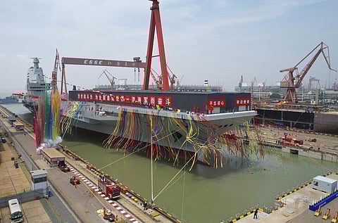 The launch ceremony for China's third aircraft carrier christened Fujian at a dry dock in Shanghai. (Photo| AP)