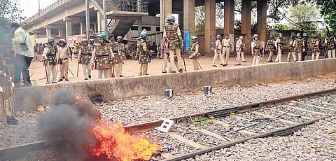 Police personnel inspect railway properties that were vandalised in Gwalior on Thursday | pti