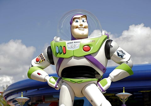 Character Buzz Lightyear stands near the entrance to the Aliens Swirling Saucers ride at Toy Story Land in Disney's Hollywood Studios at Walt Disney World in Lake Buena Vista. (Photo | AP)