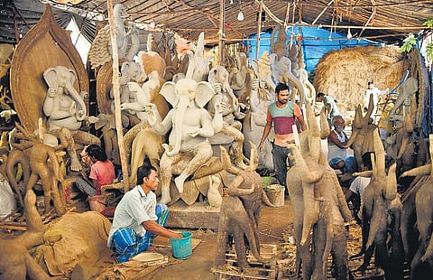 Sculptors give shape to Ganeshs idols in Hyderabad on Thursday | Vinay Madapu