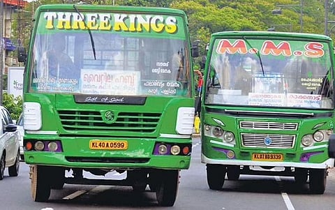 A private bus overtaking another at the High Court junction, one of the most crowded  places in Kochi