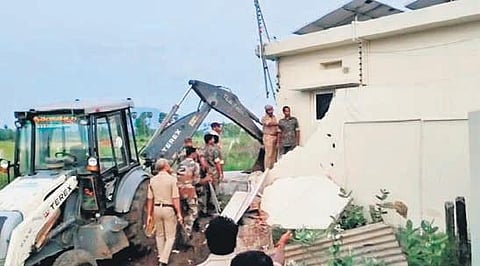 The demolished compound wall of the house of former minister and TDP Politburo member Ch Ayyanna Patrudu at Narsipatnam on Sunday. (Photo I Express)