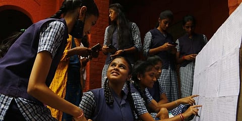 Students shows their board exam result at CCMA government girls higher secondary school in Coimbatore on Monday. (Photo | S Senbagapandiyan)