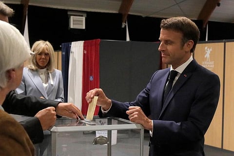 French President Emmanuel Macron casts his ballot Sunday, in Le Touquet, northern France. French voters are going to the polls in the final round of key parliamentary elections. (Photo | AP)