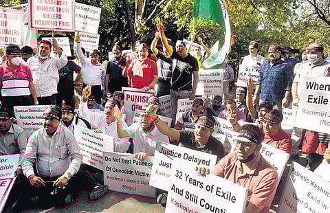 Kashmiri Pandit staffers sit on a protest to demand relocation to Jammu | File photo