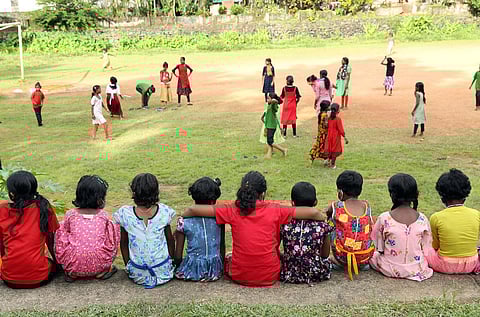 Children enrolled in Classes 1 and 2 watch their seniors play at the tribal hostel for girls at Mathirappilly near Kothamangalam in Ernakulam district. (Photo | T P Sooraj)