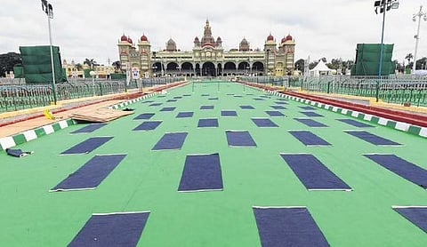 Yoga mats rolled out in front of Mysuru Palace ahead of the event | S Udayshankar