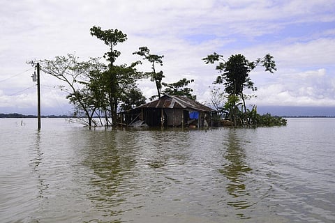A house is surrounded by flood waters in Sylhet, Bangladesh. (Photo | AP)