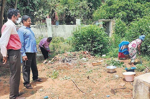 Workers clear bushes as part of the scheme at a school in Thanjavur | Express