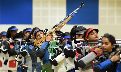 The participants taking their positions during the 10 m women’s air rifle competition at 62nd National Shooting Championship at Vattiyoorkavu shooting range. (Photo | B P Deepu)