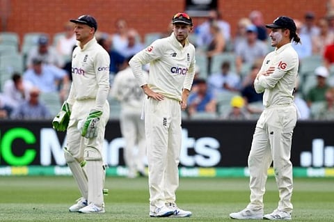 England's players (L-R) Jos Buttler, Joe Root and Rory Burns look on during the day two of the second cricket Test match of the Ashes series. (Photo | AFP)