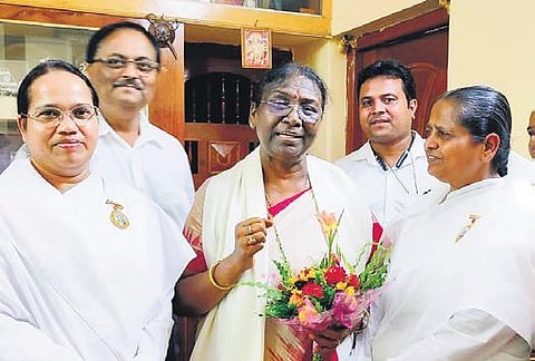 File photo of Droupadi Murmu (C) at the Brahma Kumari HQ in Rajasthan