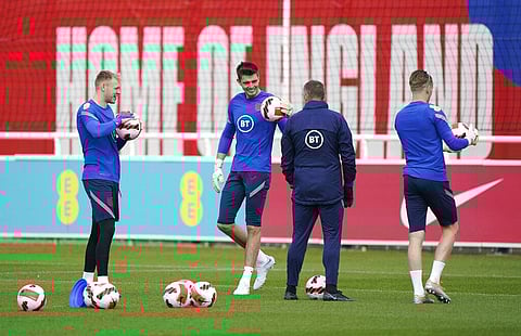 England's goalkeepers Aaron Ramsdale, left, Nick Pope and Jordan Pickford, right, attend a training session at St George's Park, Burton-upon-Trent. (Photo | AP)