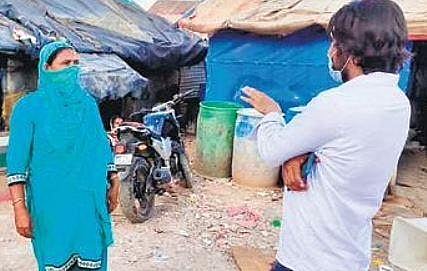 James Tahiyat, a missionary, speaks to a newly-converted Rohingya woman| Express