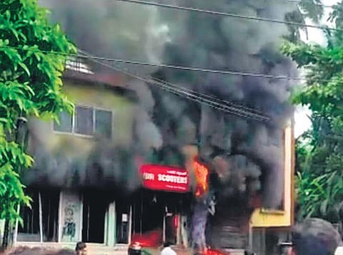 Okinawa electric vehicle dealership goes up in flame in Mangaluru. (Photo | EPS)