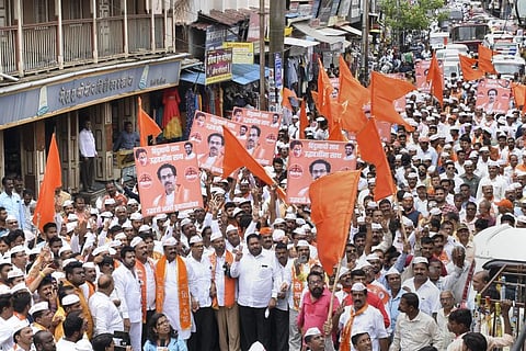 Shiv Sena workers take part in a protest rally against rebel Shiv Sena leader Eknath Shinde. (Photo | PTI)