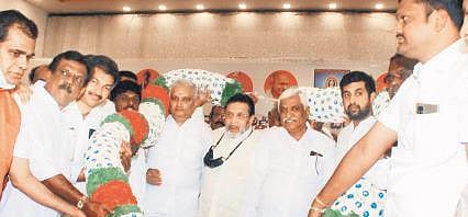 Former minister M R Seetharam (centre) flanked by his supporters during a meeting at the Palace Grounds in Bengaluru on Friday | Express