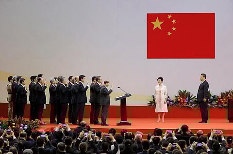 - Chinese President Xi Jinping, right, administers the oath to Hong Kong's new Chief Executive Carrie Lam's new cabinet in office at the Hong Kong Convention. (Photo | AP)