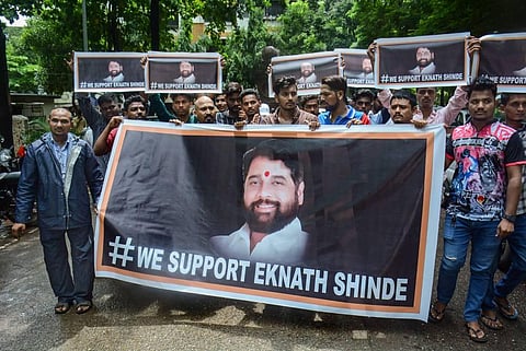 Supporters of rebel Shiv Sena leader Eknath Shinde outside his residence, in Thane, Wednesday, June 22, 2022. (Photo | PTI)