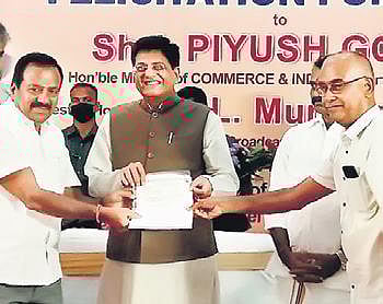 Representatives of the Dyers Association of Tiruppur give a petition to Union minister Piyush Goyal on Sunday. (Photo | Express)
