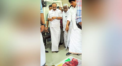 Kalpetta MLA T Siddique shows Leader of Opposition V D Satheesan the broken photo of Mahatma Gandhi inside Rahul Gandhi’s office in Wayanad on Saturday | Express 