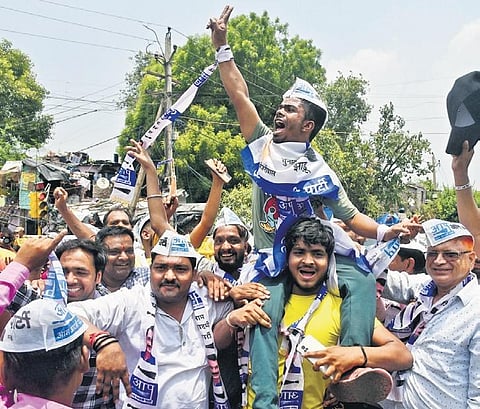 AAP workers and members celebrate party candidate Durgesh Pathak’s win in  Rajinder Nagar by-elections on Sunday | Parveen negi