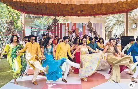 Utsav Malhotra and Kamna Arora with their wedding crew