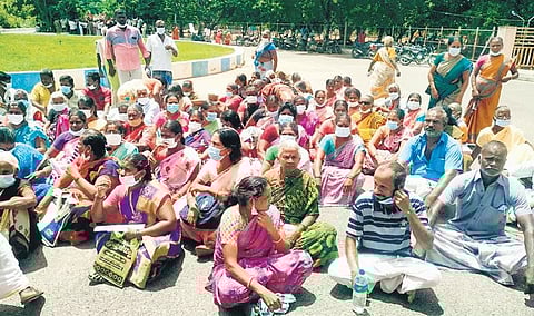 Residents of Athiyur village in Kunnam taluk staged a protest at the Collectorate. (Photo Express)