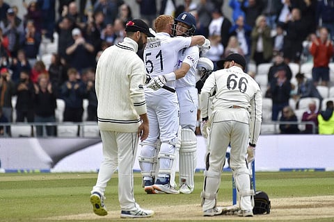 England's Joe Root, center right, hugs batting partner Jonny Bairstow to celebrate their win. (Photo | AP)